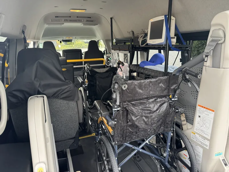 The cabin seen from the rear door, with two wheelchairs secured