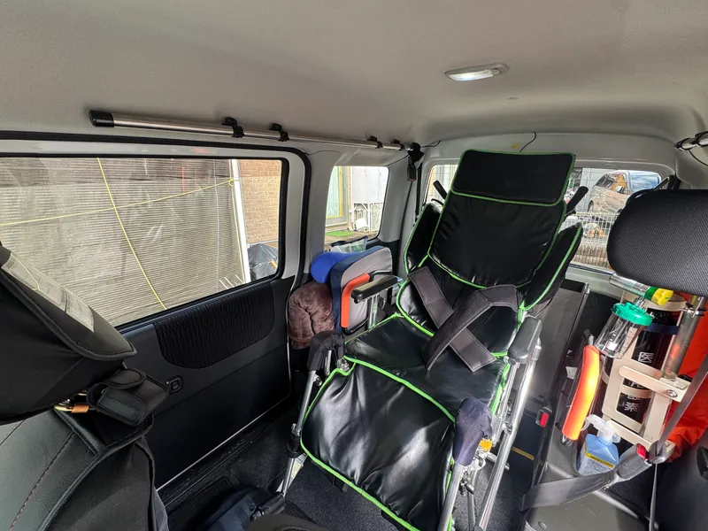 A reclining wheelchair secured inside our vehicle
